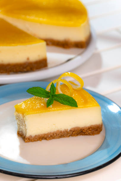 istock Lemon cheesecake with lemon peel and mint leaves. 1317691364