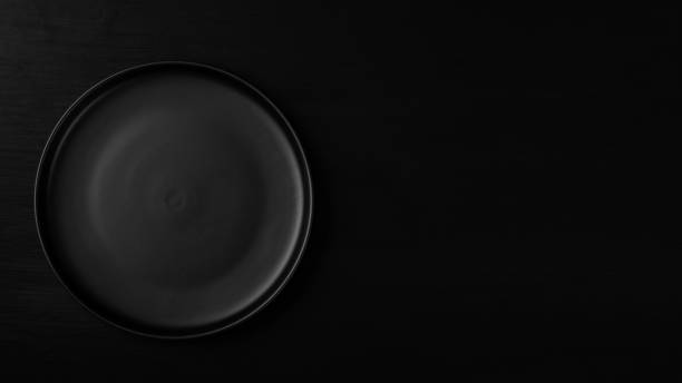 istock Empty metal tray on a black background. Space for text 1317693236