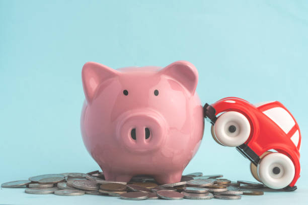 istock Red car on stacked coins stock photo 1317697152