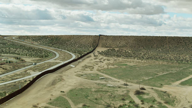 istock US/Mexico Border Wall Near El Paso Running Up Steep Hillside 1317711651