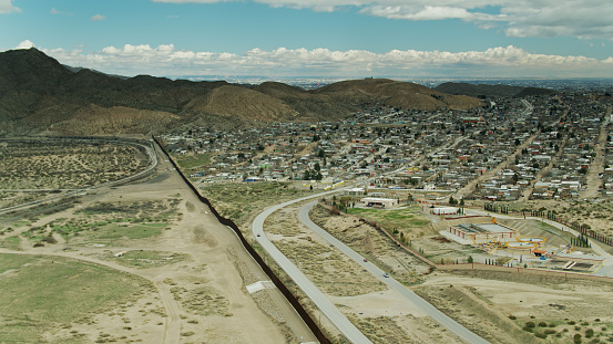 Aerial view of the US/Mexico Border Wall separating New Mexico and Chihuahua. Shot from US airspace.