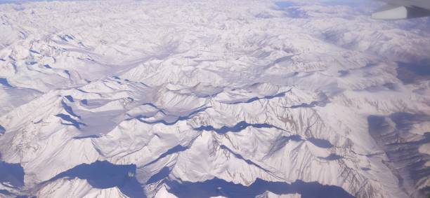 istock Winter mountains from the plane window 1317713106