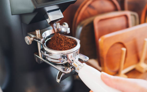 istock A barista grinding coffee in coffee shop 1317724993