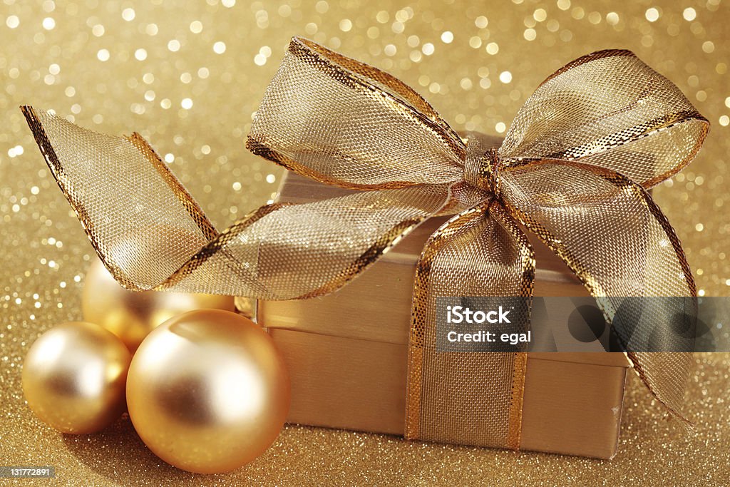 Christmas gift box Christmas gift box on golden background Birthday Stock Photo