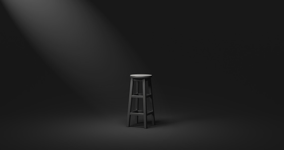 Black chair and spotlight low key tone on empty dark room background with alone or darkness concept. 3D rendering.