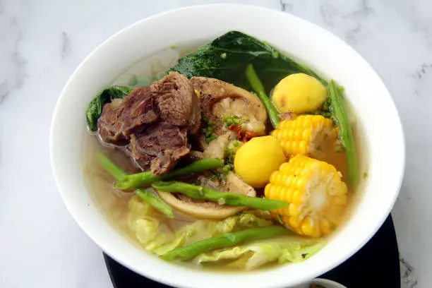 Bowl of freshly cooked Filipino food called Bulalo or Beef Marrow Stew.