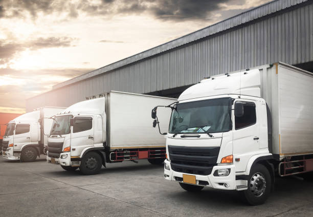istock Container Trucks Parked Loading at Dock Warehouse. Shipping Warehouse Logistics.Cargo Shipment. Industry Freight Truck Transportation. 1317731975