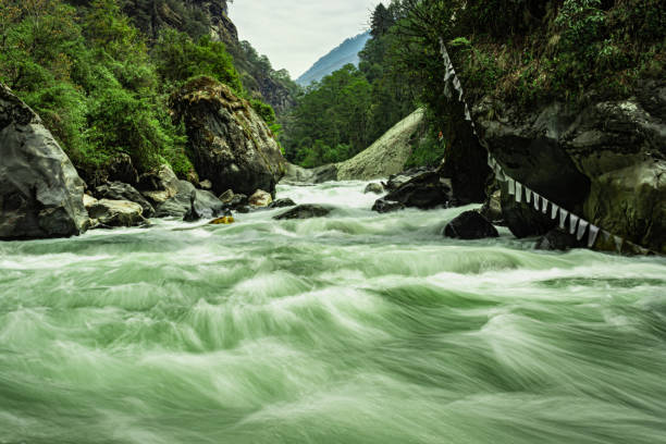 istock mountain river extreme water flow at day long exposure 1317732077