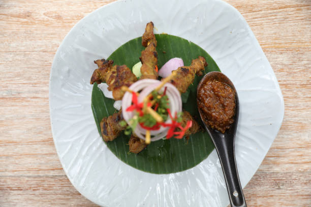 istock Chicken Satay on dark brown table street food appetizer 1317732228