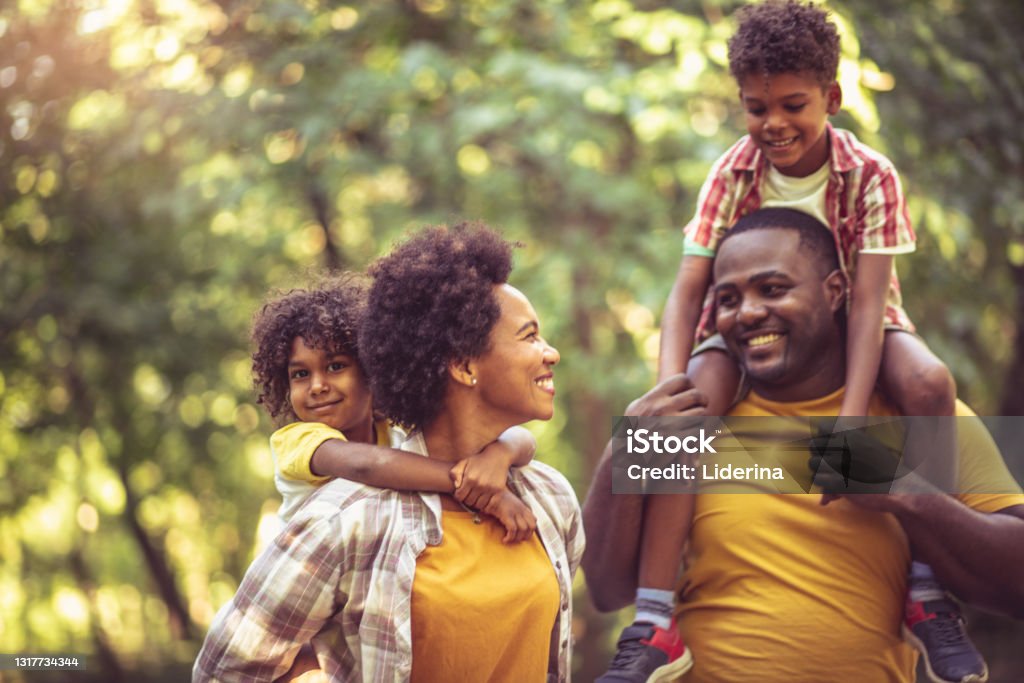 African American family having fun outdoors. Family Stock Photo