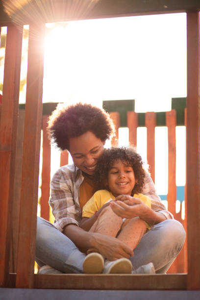 istock Mother and daughter on playground. 1317734366