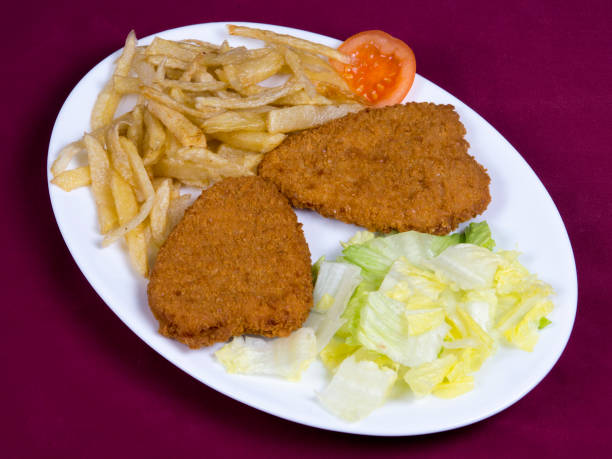 istock Breaded chicken fillets with potatoes 1317737885