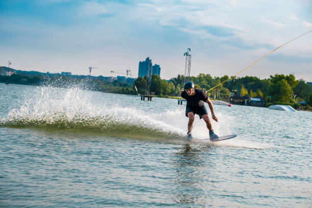 istock Wakeboarder holding tow rope with hand behind back 1317738160