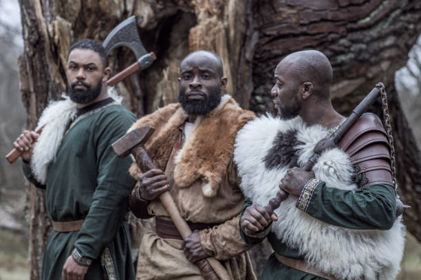 istock Small group of African Warriors in a forest 1317740611