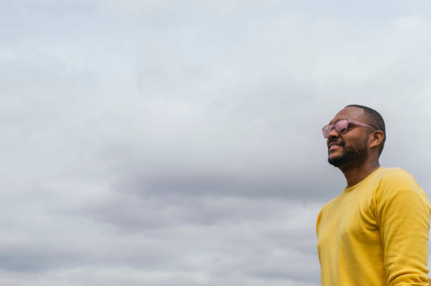 istock Black man looking at the horizon in a park 1317741284