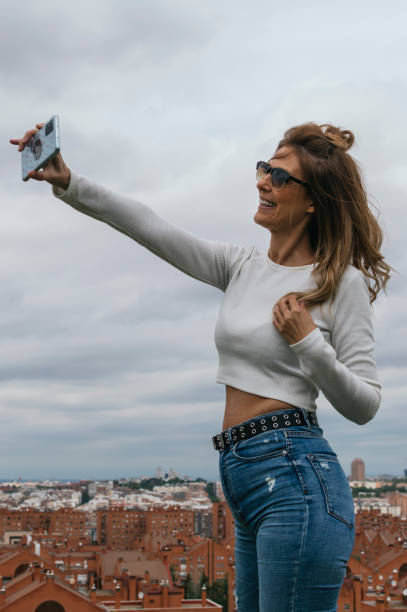 istock Attractive young woman taking a selfie and smiling 1317741357