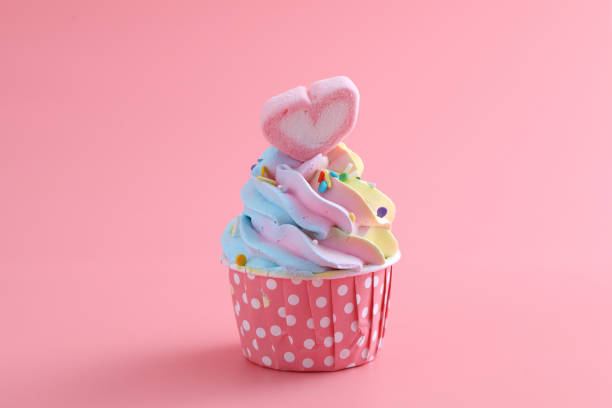 istock colorful cupcake isolated in pink background 1317742138