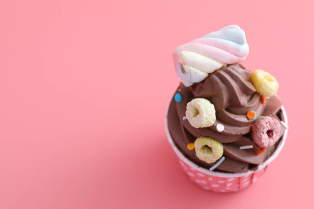 istock Chocolate cupcake isolated in pink background 1317742517