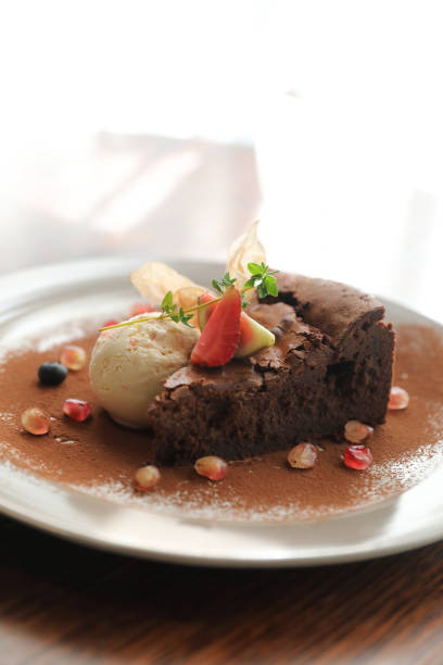 istock Chocolate cake with ice cream dessert on wood table 1317742637