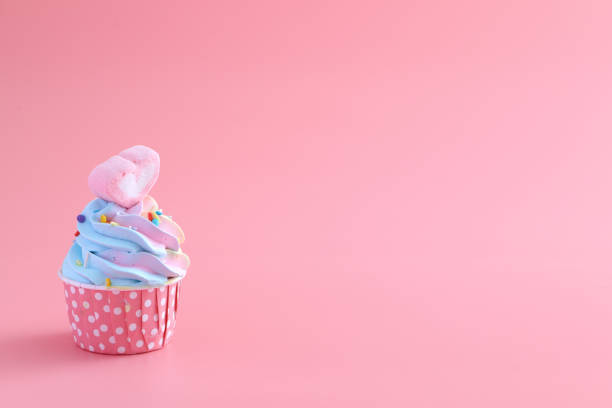 istock colorful cupcake isolated in pink background 1317742760