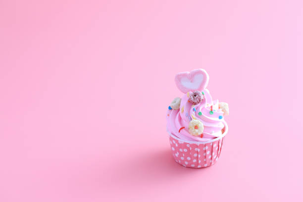 istock cupcake isolated in pink background 1317742765
