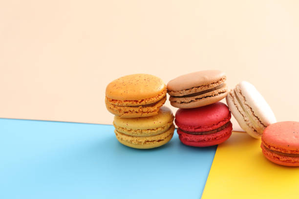 istock Colorful macarons isolated in pastel background 1317742786