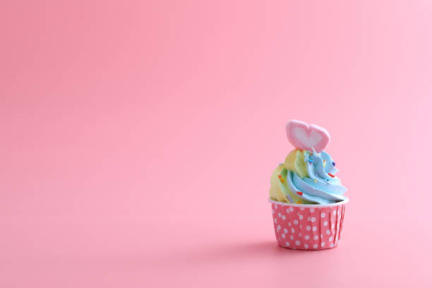 istock colorful cupcake isolated in pink background 1317742866