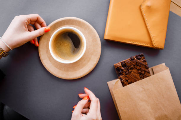 istock Black strong morning coffee in eco paper cups. Freelance work. 1317743859