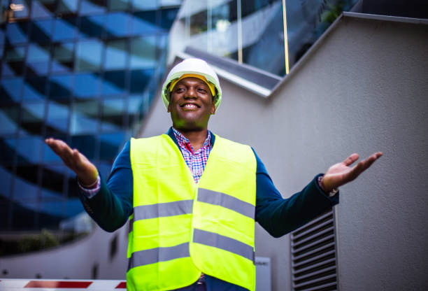 istock Smiling engineer standing on the street. 1317744278