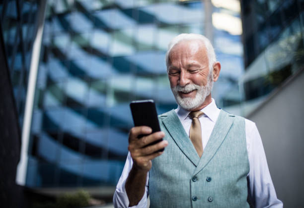 istock Senior business man using smart phone. 1317745356
