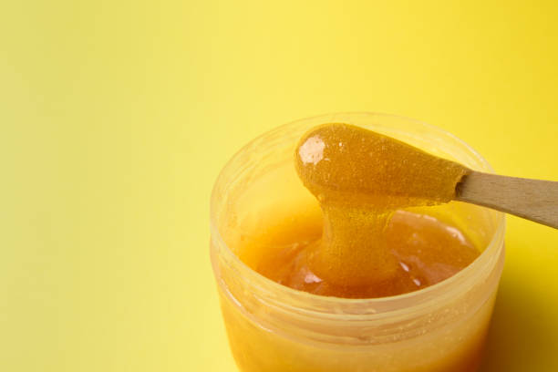 istock Liquid sugar wax in jar with spatula 1317746975