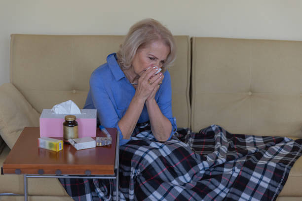 istock Ill Senior Woman Caught a Flu Virus and High Temperature. 1317748405