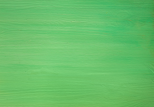 Green painted wooden background. Top view