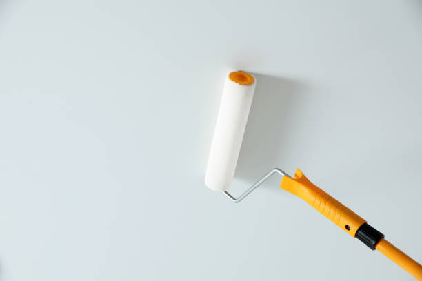 istock Painting ceiling with white dye indoors, low angle view. Space for text 1317749463
