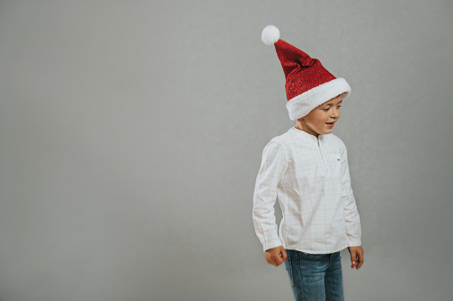 Boy wearing a Christmas hat