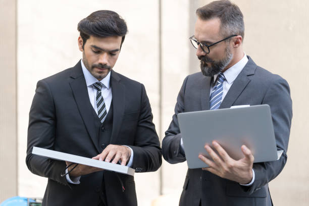 istock Business people are discussing solar panel trading. 1317749637