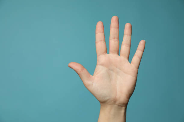 Female Hand Shows Five Finger Over White Background