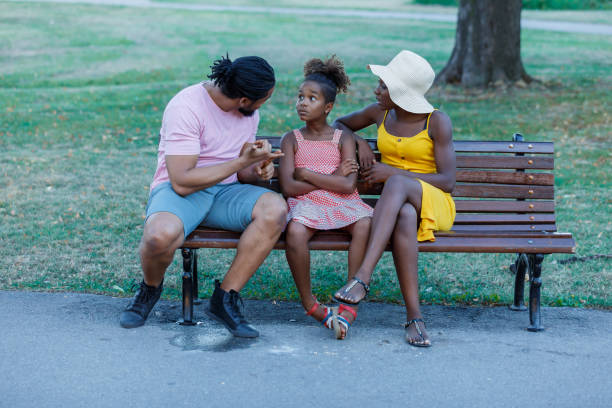 istock An African Family is Talking About the Problems in Public Park. 1317749896