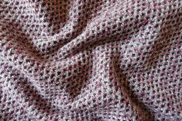 Rumpled thick pink, grey and white woolen fabric with diamonds pattern Rumpled thick pink, grey and white woolen fabric with diamonds pattern unprinted stock pictures, royalty-free photos & images
