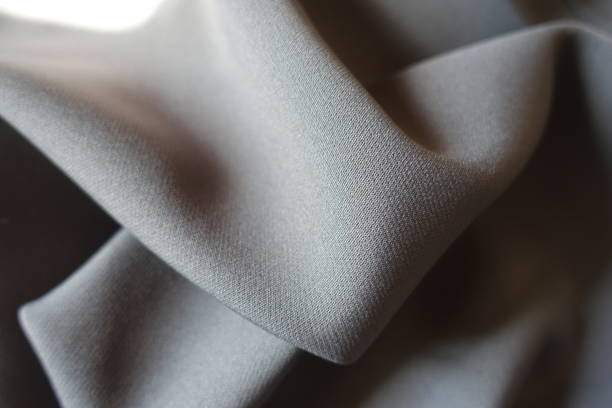 istock Gray viscose and polyester fabric in soft folds 1317751507