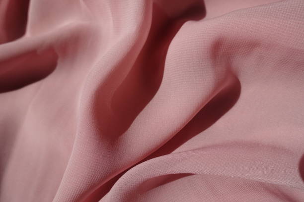istock Simple thin pastel pink chiffon fabric in soft folds 1317751535
