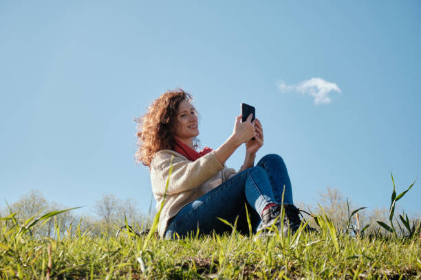 istock Young girl with a phone in her hands 1317753350