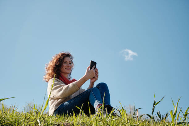 istock Young girl with a phone in her hands 1317753351