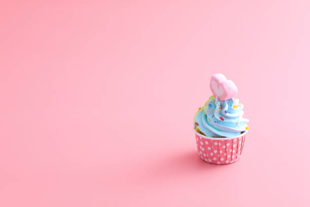 istock colorful cupcake isolated in pink background 1317758870