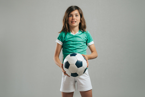 Girl posing with soccer ball