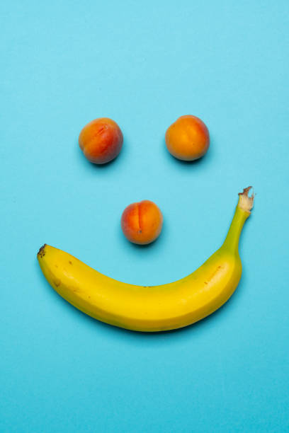 istock Banana and peaches happy face still life 1317759594