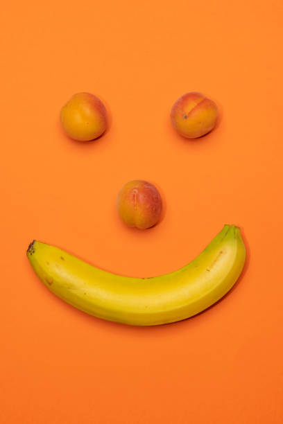 istock Banana and peaches happy face still life 1317759595