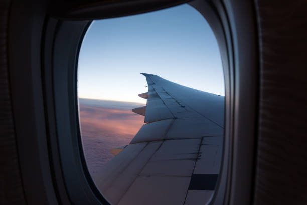 istock View from airplane window to the sky and plane wing 1317760956
