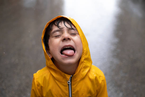 istock Adorable little boy playing at rainy day 1317761500