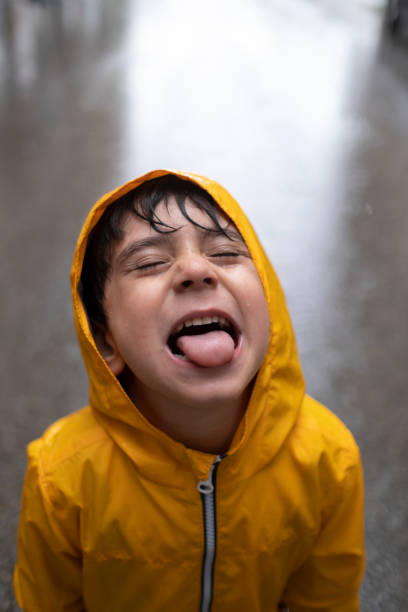 istock Adorable little boy playing at rainy day 1317761978